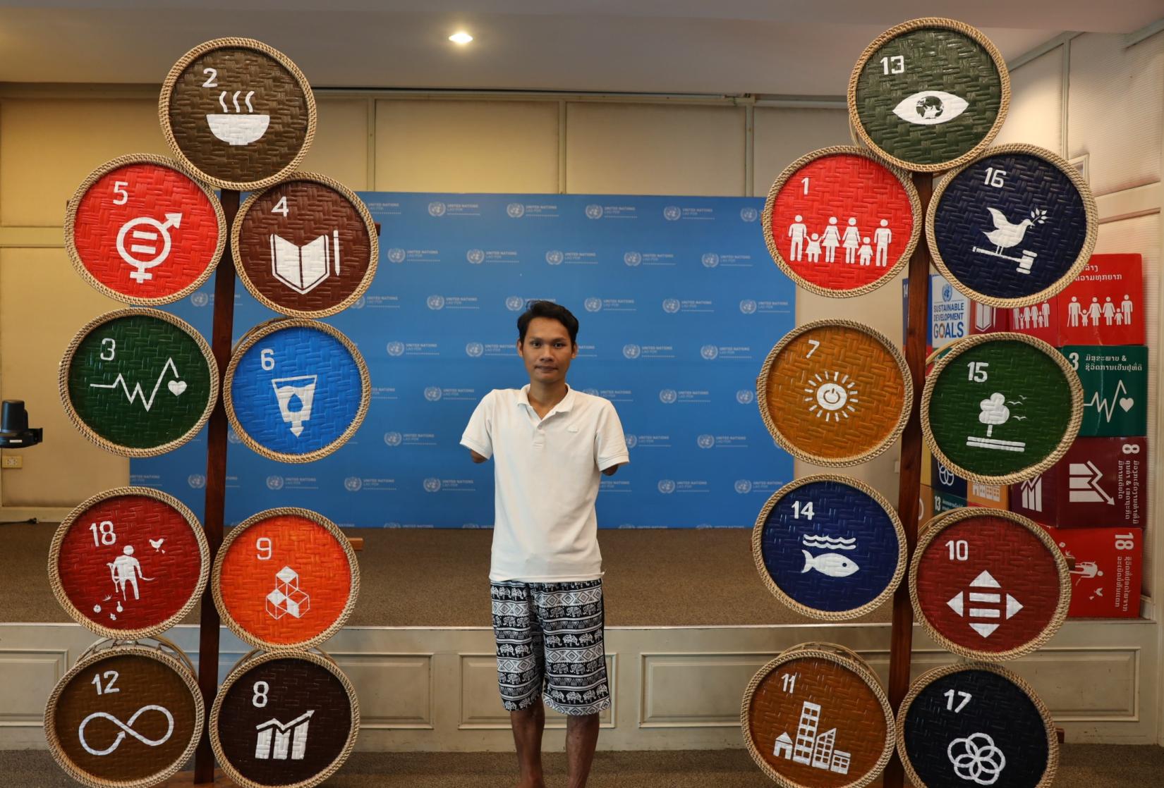 Artist (Seevanh) standing in between the SDG installation