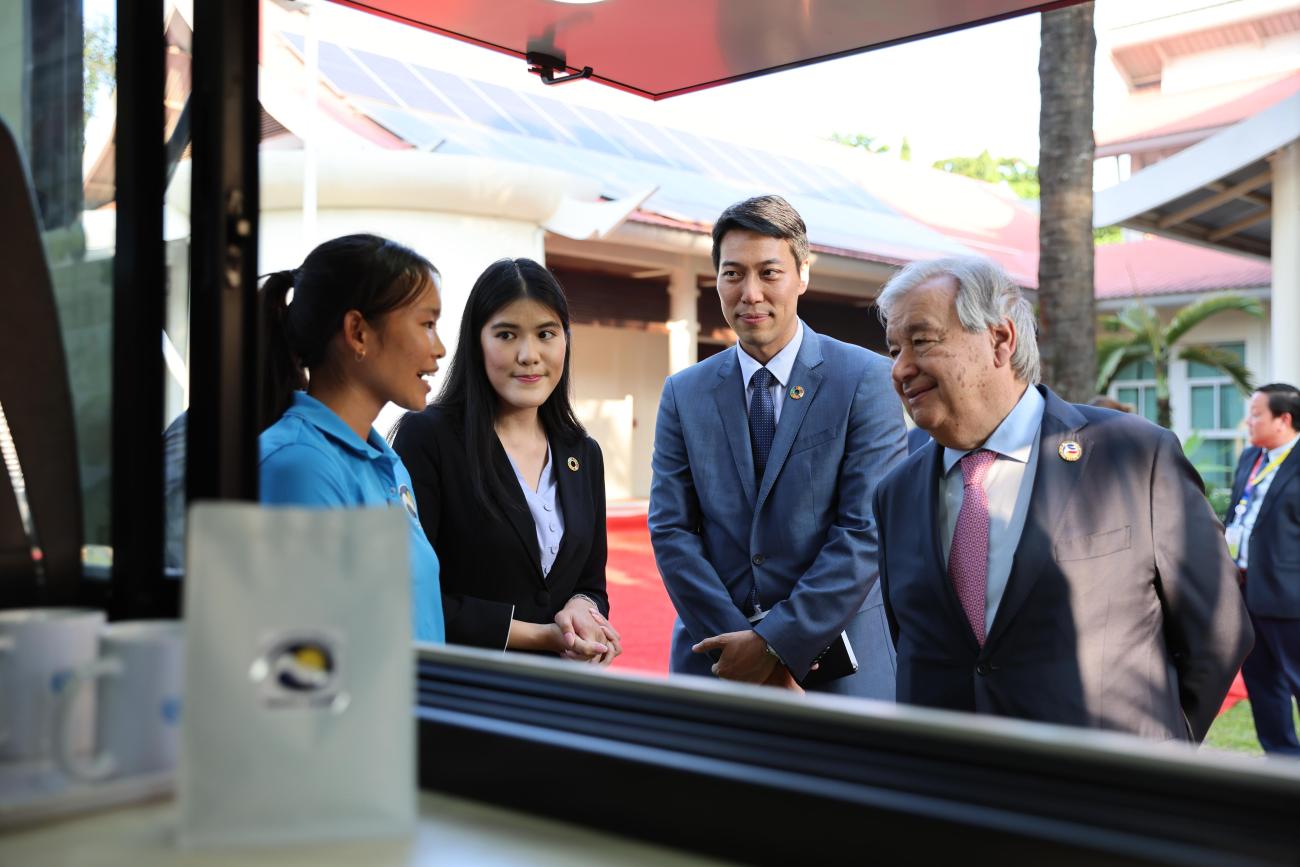 UN Secretary-General António Guterres meets with Vanmai Cooperative member, Pheurp, with UNODC officers