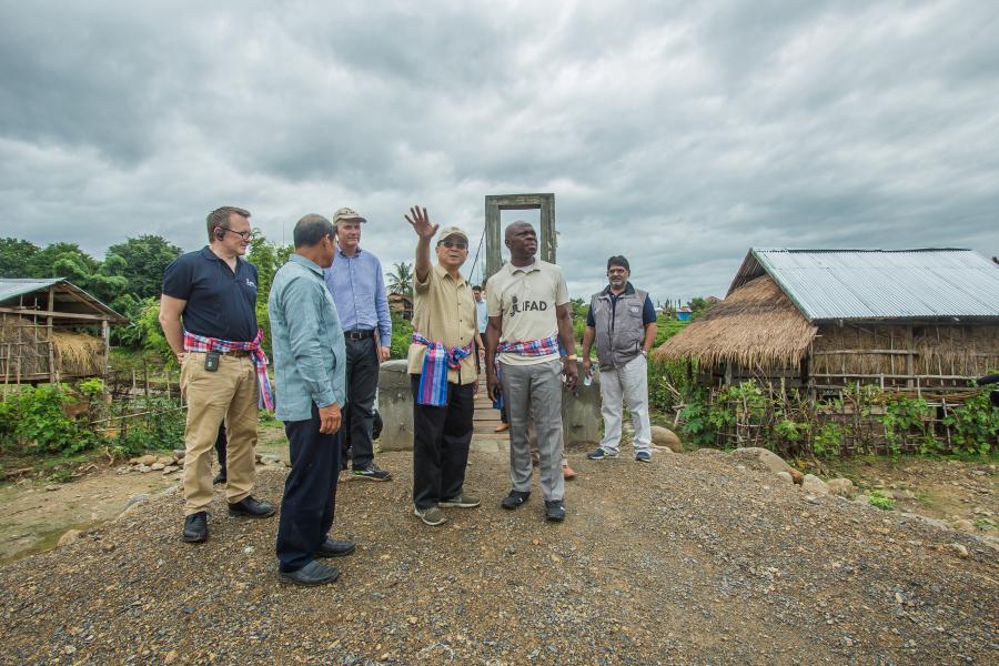 Mr. Gilbert F. Houngbo visits the bridge built by IFAD in Ban San village.